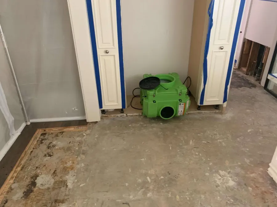 A green air mover drying a cleared Calabasas room
