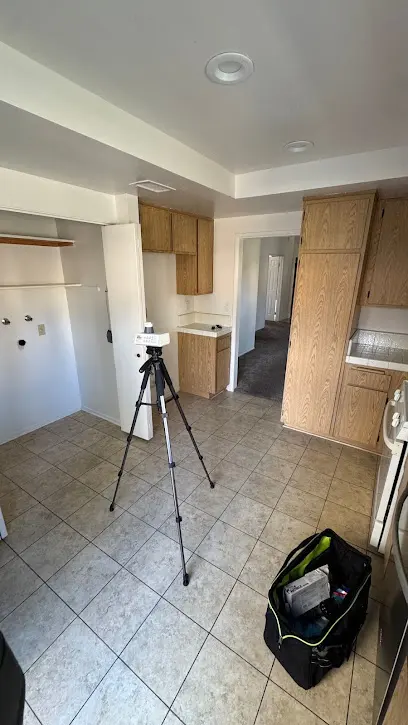Kitchen cabinets and floor being dried after an appliance supply line leak in Calabasas, CA