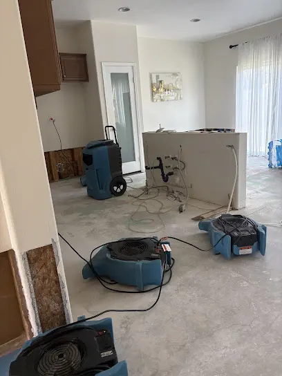 Air movers and a dehumidifier drying a Calabasas, CA home interior